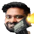 a man with a beard is smiling and holding a gun .