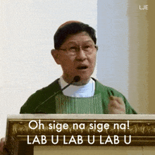 a man speaking into a microphone with the words oh sige na sige na lab u lab u lab u written below him
