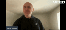 a man in a black nike shirt is talking on a video call
