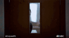 a man and a woman are standing in a dark hallway with the hashtag #chicagopd
