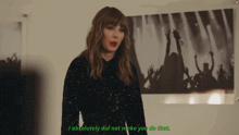 a woman is standing in front of a poster that says i absolutely did not make you do that ..