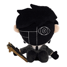 a stuffed toy of a man in a suit and tie holding a sword