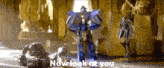 a robot is standing in a room next to a horse and statue .
