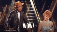a man and a woman are standing next to each other with the word wow on the bottom