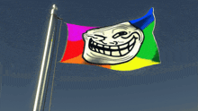 a troll face on a rainbow flag flying in the wind