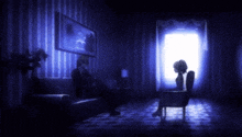 a man sits on a couch in a dark room while a woman sits in a chair