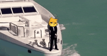 a man in a suit and tie is standing on the side of a yacht .