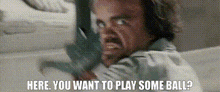 a man wearing headphones is making a funny face and says here you want to play some ball .