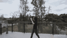 a woman is dancing on a balcony with the words made in animotica above her