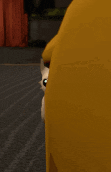 a cartoon cat is standing next to a large yellow duck .