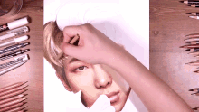 a person is drawing a picture of a man 's face