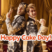two men are covered in cake and the words happy cake day