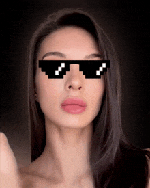 a woman wearing a pair of sunglasses with a pixelated face on them