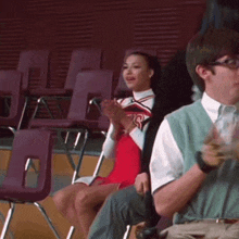 a cheerleader wearing a red dress with the letters rs on it