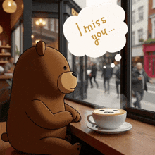 a teddy bear is sitting at a table with a cup of coffee and a speech bubble that says i miss you