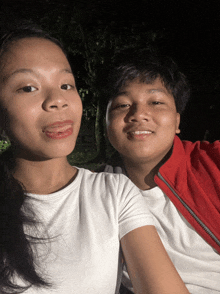 a man and a woman are posing for a picture together