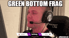a man wearing headphones with the words green bottom frag written above him