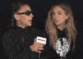 a woman is holding a microphone that says rolling stone