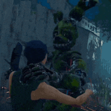 a man is being attacked by a green monster