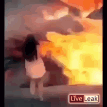 a blurred image of a fire with a live leak sign