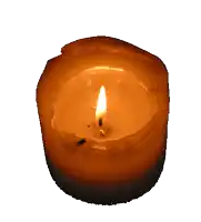 a burning candle with a white background and a small flame