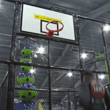 a basketball hoop with a yellow sticker on it that says ' basketball '