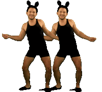 two men wearing black tank tops and shorts are dancing together