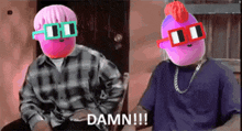 two stuffed animals wearing sunglasses are sitting next to each other and one of them says " damn !!! "