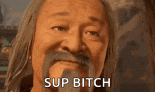 a man with long hair and a mustache is making a funny face and saying `` sup bitch '' .