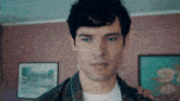 a close up of a man 's face in a room