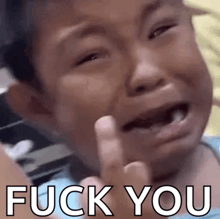 a child is crying and giving the middle finger with the words " fuck you " written below him