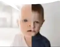 a close up of a baby 's face with a speech bubble above it .