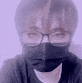 a person wearing glasses and a face mask