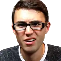 a young man wearing glasses makes a funny face