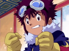 a young boy wearing a goggles and gloves is making a funny face .