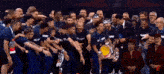 a group of people are posing for a picture and one of them has a shirt that says ' champs ' on it
