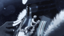 a close up of a person 's arm with a necklace that has a s on it