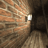 a brick wall with a lamp on it and a wooden floor