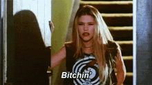 a woman is standing on a set of stairs and saying bitchin