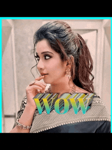 a woman 's face is shown with the word wow above her
