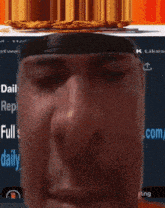 a close up of a man 's face in front of a screen that says daily on it