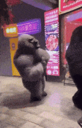 a gorilla is dancing in front of a restaurant with chinese writing