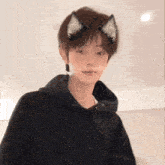 a young man with cat ears on his head