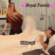 a woman standing next to a man on a bed with the words royal family written above them