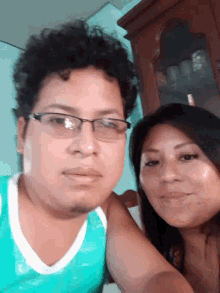 a man and a woman are posing for a picture