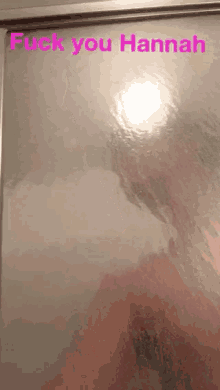 a picture of a person in a shower with the words " fuck you hannah " above it