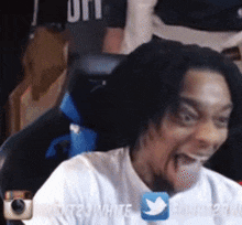 a man in a white shirt is making a funny face with a twitter logo in the corner