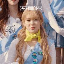 a girl with blonde hair is wearing a yellow bandana and a blue sash with a badge that says ' rock '