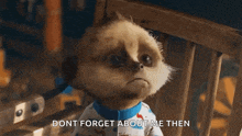 a cartoon meerkat is sitting in a chair and saying " dont forget about me then " .