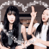 two girls are dancing and the words huna y tisi are visible behind them